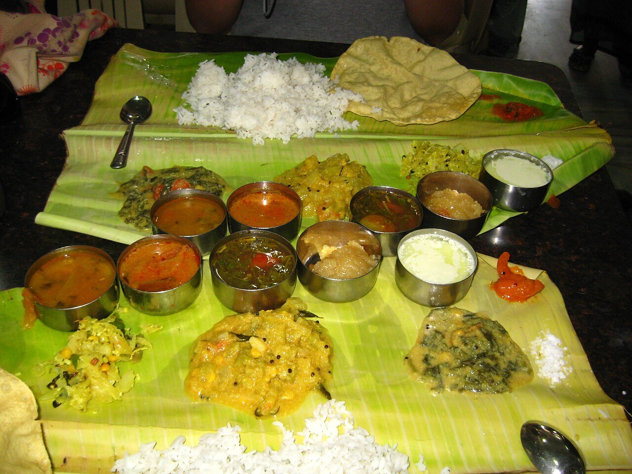 Volunteers serving warm meals during Annadanam